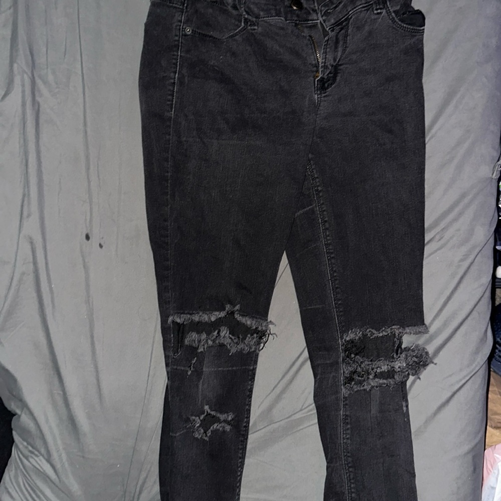 Low rise skinny black jeans with holes